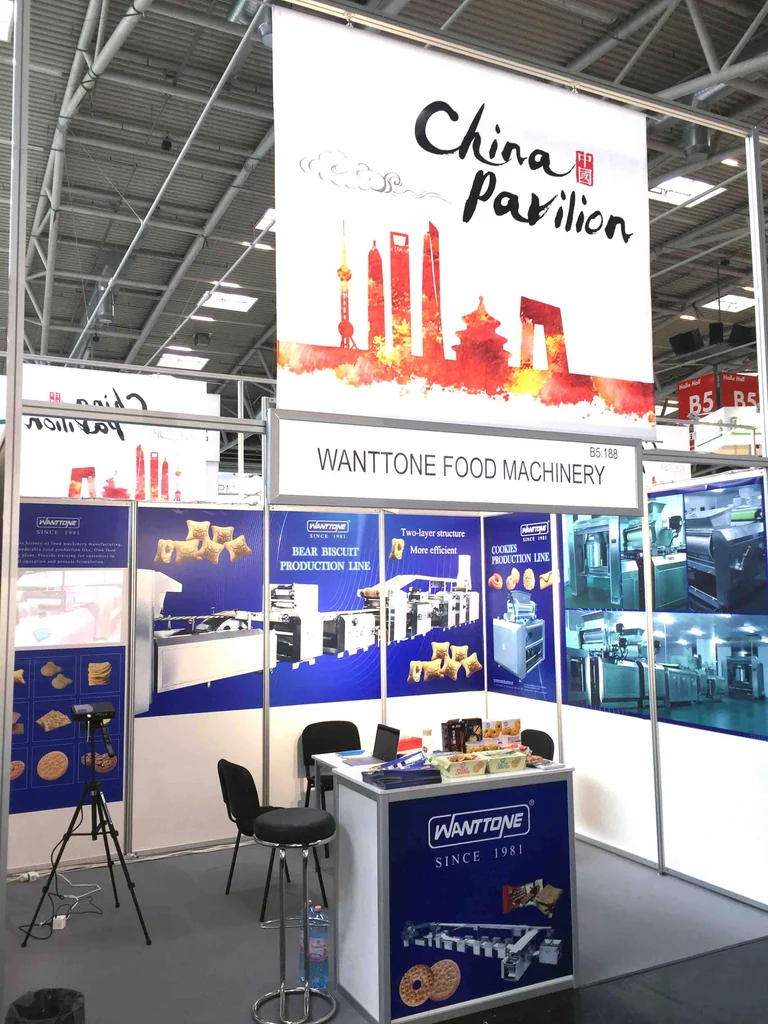 Wanttone biscuit machinery booth below the China Pavilion sign at an exhibition in Germany