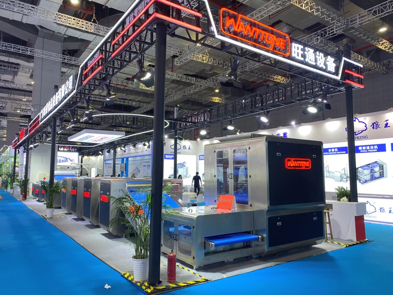 Wanttone machinery and illuminated booth signs at an exhibition in Shanghai