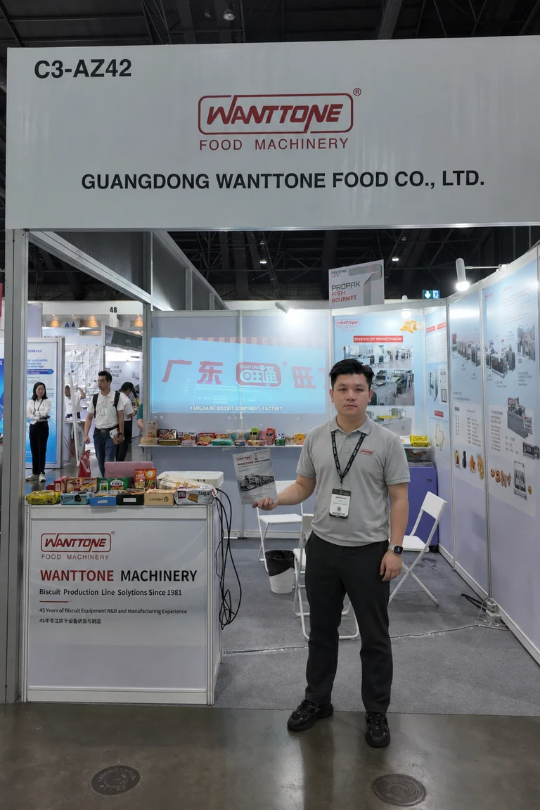 A Wanttone representative standing at the company exhibition booth in Thailand