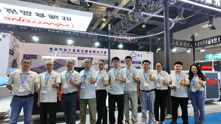 The Wanttone team gathered in front of its Shanghai exhibition booth